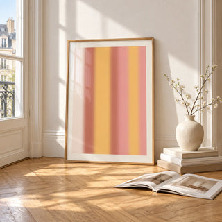 Dusty Pink Wall Art, framed and leaning on the parquet floor of a bright living room