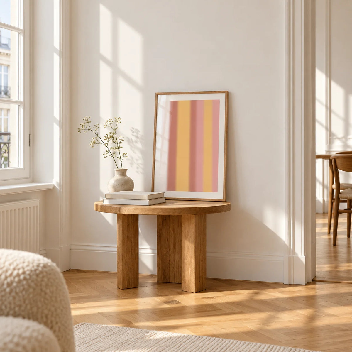 Dusty Pink Wall Art, a small A4 framed print leaning on a small solid oak side table