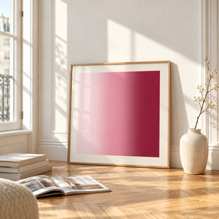 Dusty Rose Wall Art, framed and leaning on the parquet floor of a bright living room