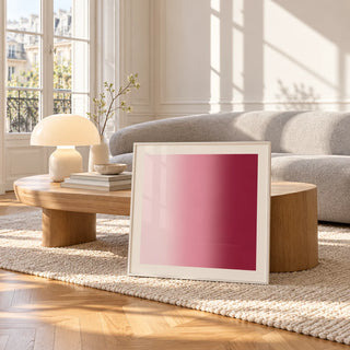 Dusty Rose Wall Art, framed and leaning against a coffee table in a bright living room