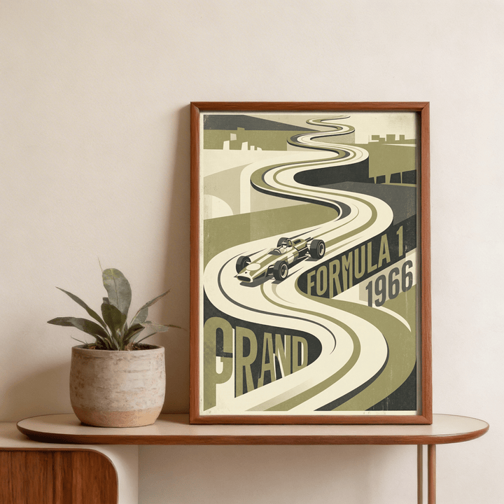 Framed Vintage Grand Prix Car Poster leaning on a wooden table with a potted plant