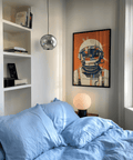 Modern Astronaut Poster using orange, blue, and beige for bedroom décor