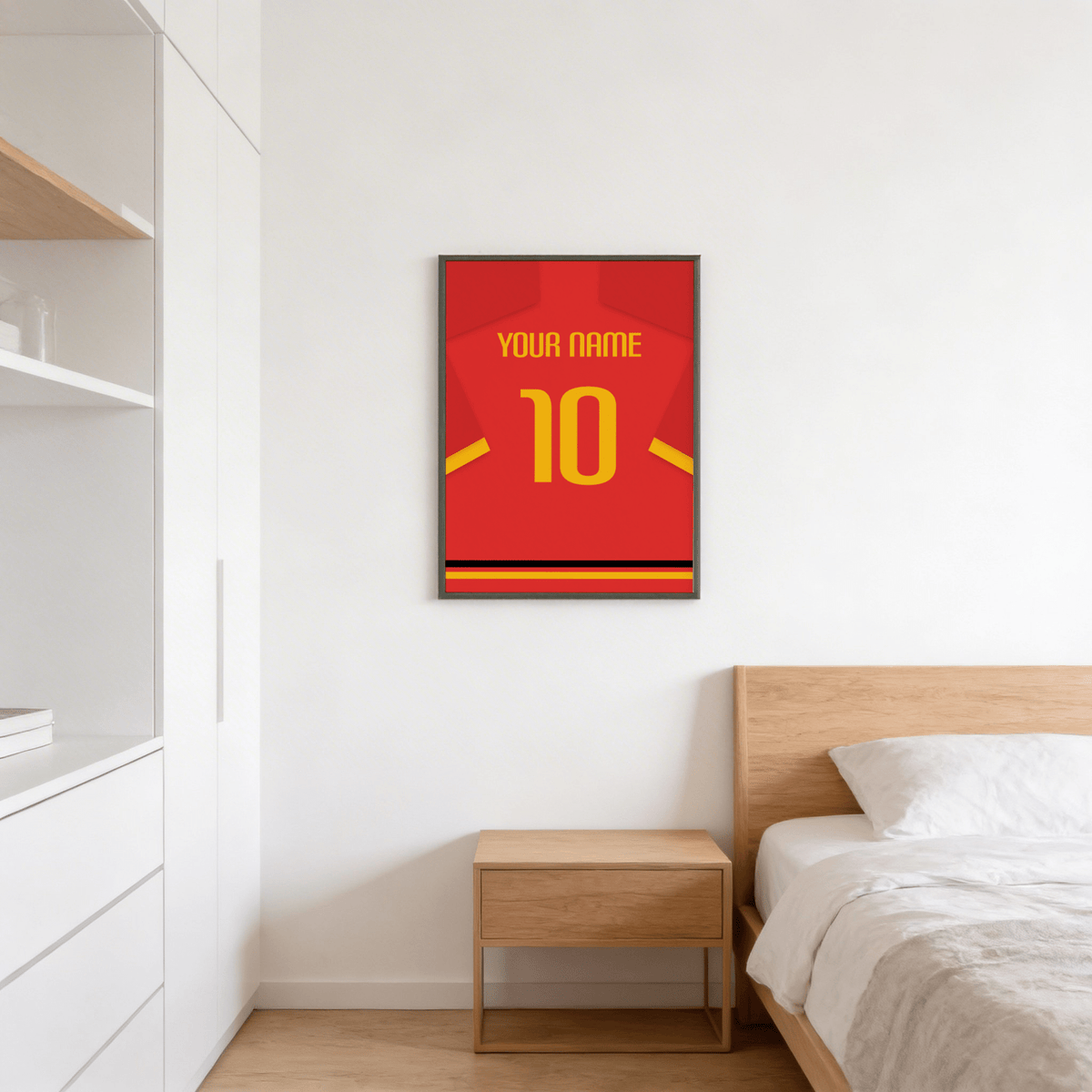 Framed red jersey print featuring yellow shoulder name text and large black-edged 10