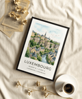 Illustrated travel poster showing houses by a winding river in Luxembourg