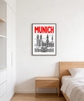 Desk styling scene with framed city skyline line illustration in red and black