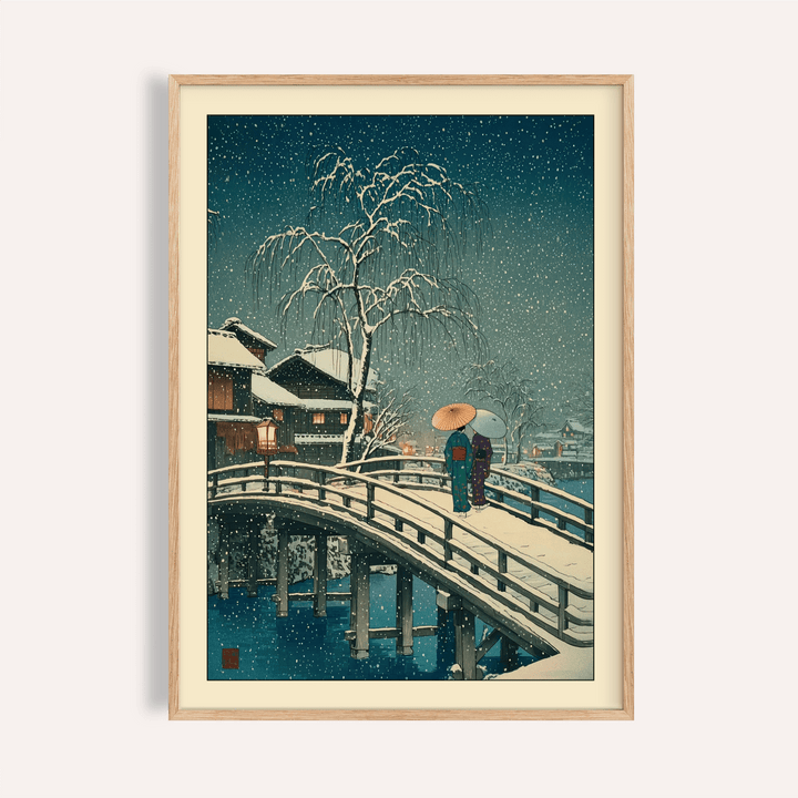 Overhead view of framed Hasui Kawase snow print on a studio table