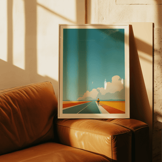 Graphic travel-style print featuring a bicycle rider and big clouds