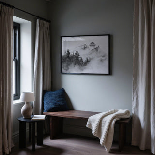Minimalist mountain art with layered hills and fog surrounding traditional architecture.