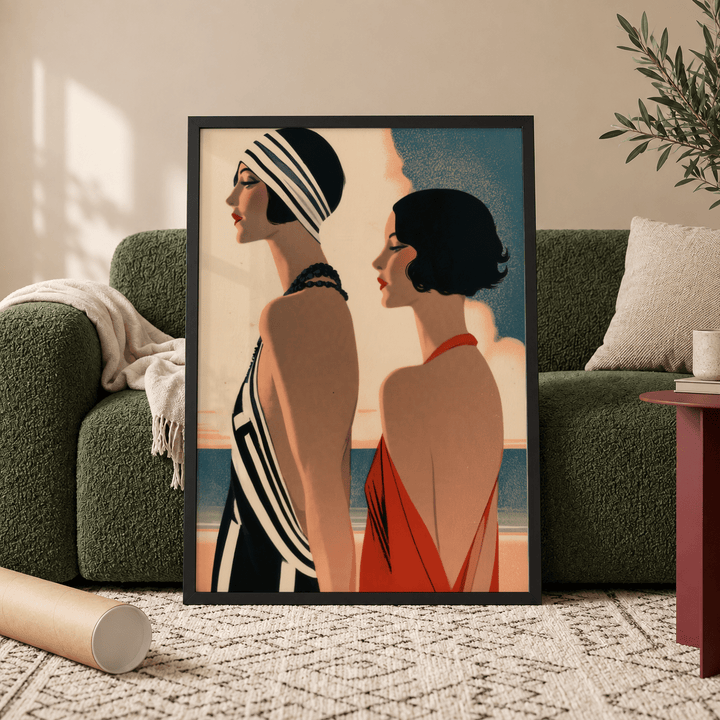 Framed Art Deco Riviera Fashion Print showing two elegant women in earthy and blue tones leaning against a green sofa