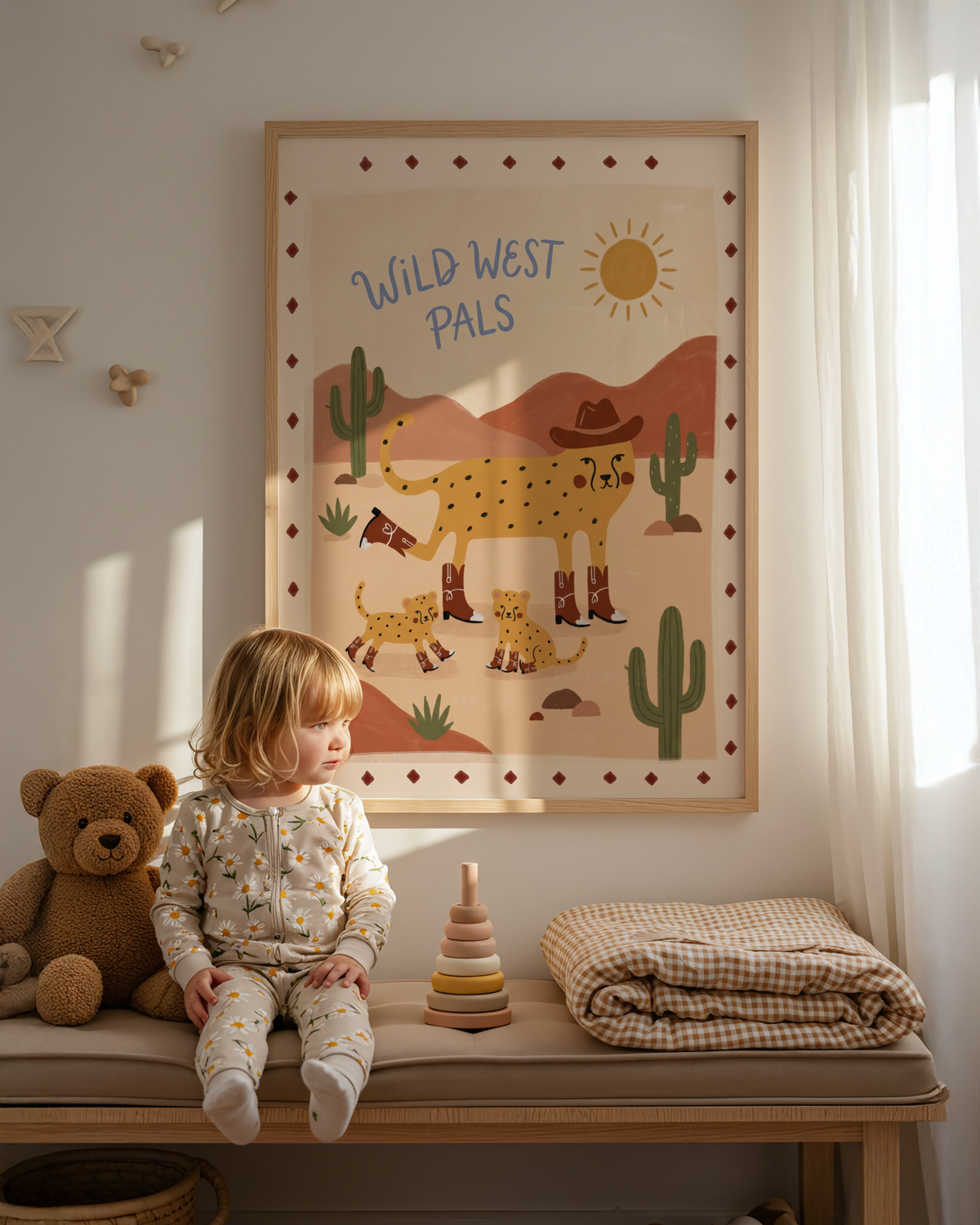 Hand-lettered "Wild West Pals" kids poster with cheetah family, sun icon, and cactus silhouettes