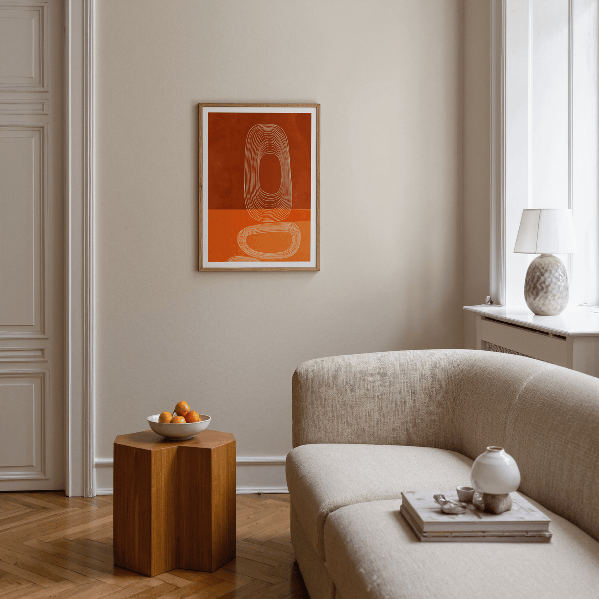 Vertical wall art showing white ovals over brown and orange blocks