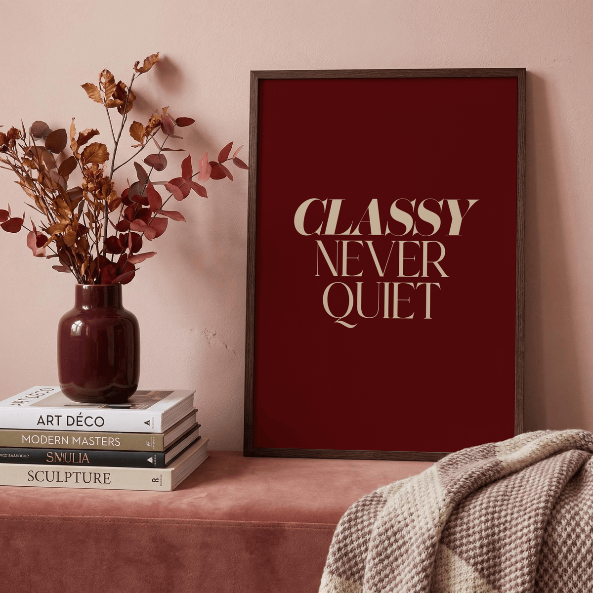 Centered typography art with bold serif lettering and generous negative space on a red field