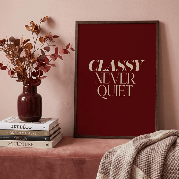 Centered typography art with bold serif lettering and generous negative space on a red field