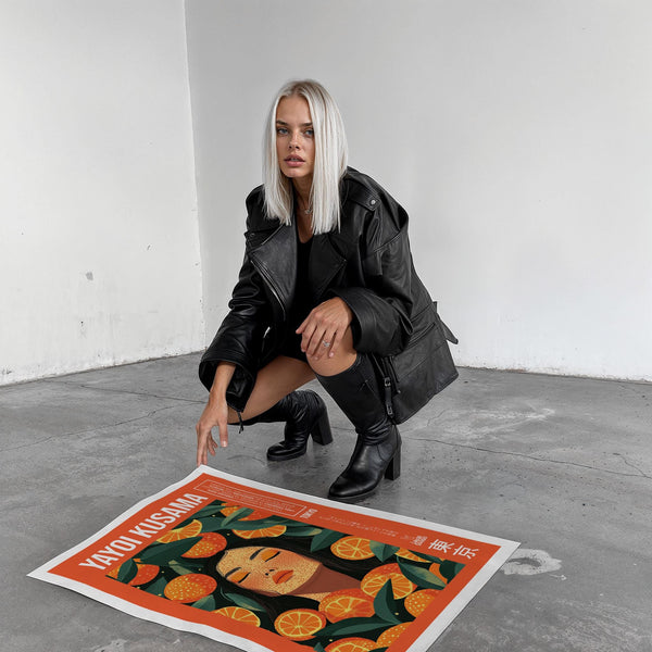 Cool wall art with a surreal female figure among illustrated oranges.