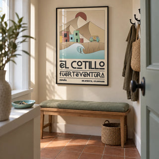 El Cotillo Surfing Poster, framed on the wall of a compact entrance hallway in a renovated UK terrace with a sand beige wall and plain terracotta floor tiles