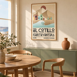 El Cotillo Surfing Poster, framed on the wall of a modern dining corner in a UK coastal flat with warm cream plaster walls