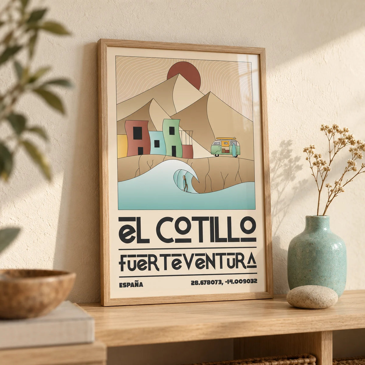 El Cotillo Surfing Poster, a small A4 framed print leaning on a pale oak shelf in a living room