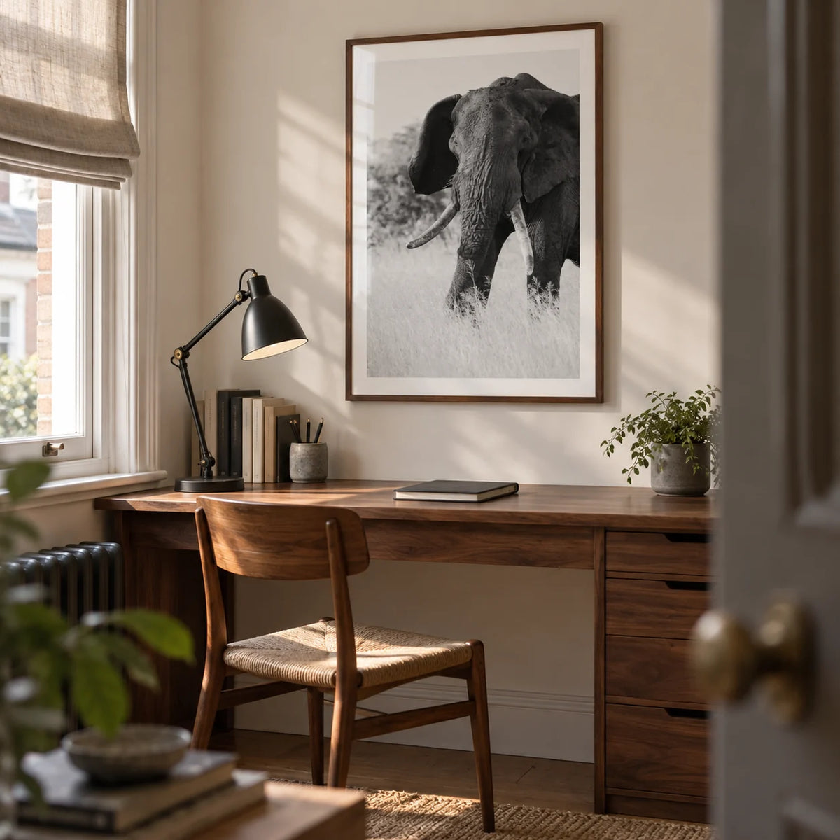 Elephant Black And White Art Print, framed on the wall of a quiet home study in a Victorian terrace with a warm white wall and a fitted walnut desk