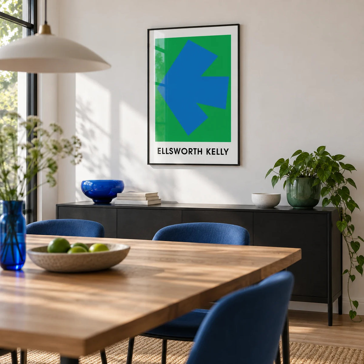 Ellsworth Kelly Art Print, framed on the wall of a modern dining room with a white wall