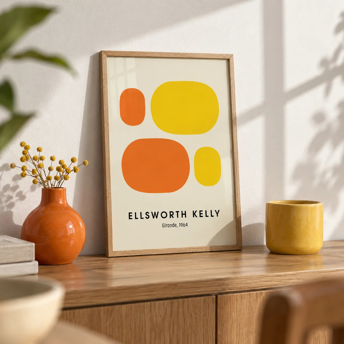 Ellsworth Kelly Prints, a small A4 framed print leaning on an oak shelf in a living room
