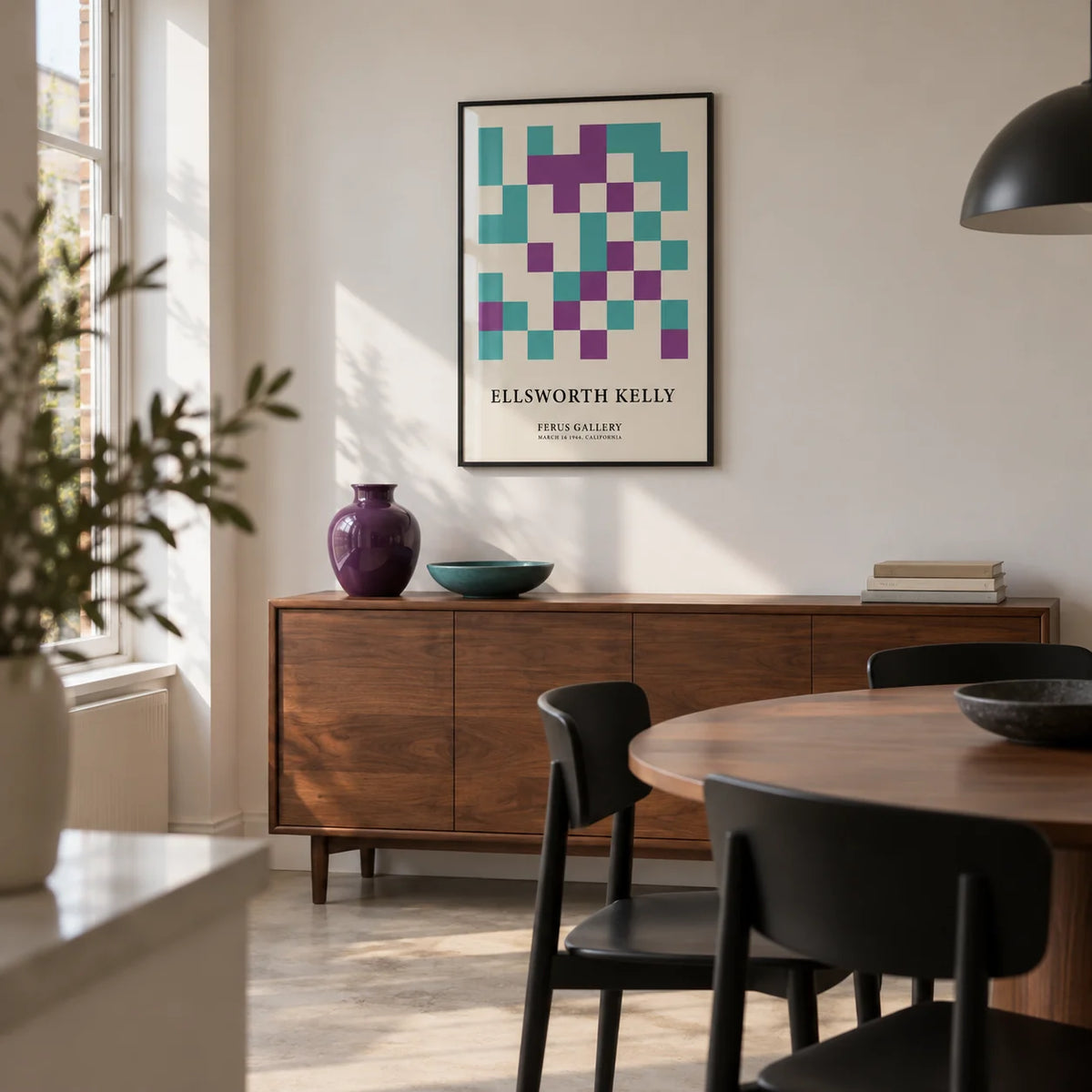 Ellsworth Kelly Pictures, framed on the wall of a compact modern dining room in a UK townhouse with off-white walls and a pale concrete floor