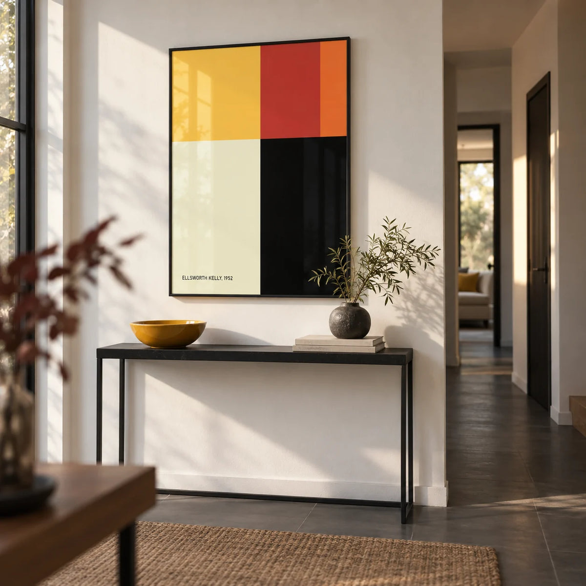 Ellsworth Kelly Poster, framed on the wall of a modern hallway with a white wall and a dark grey floor
