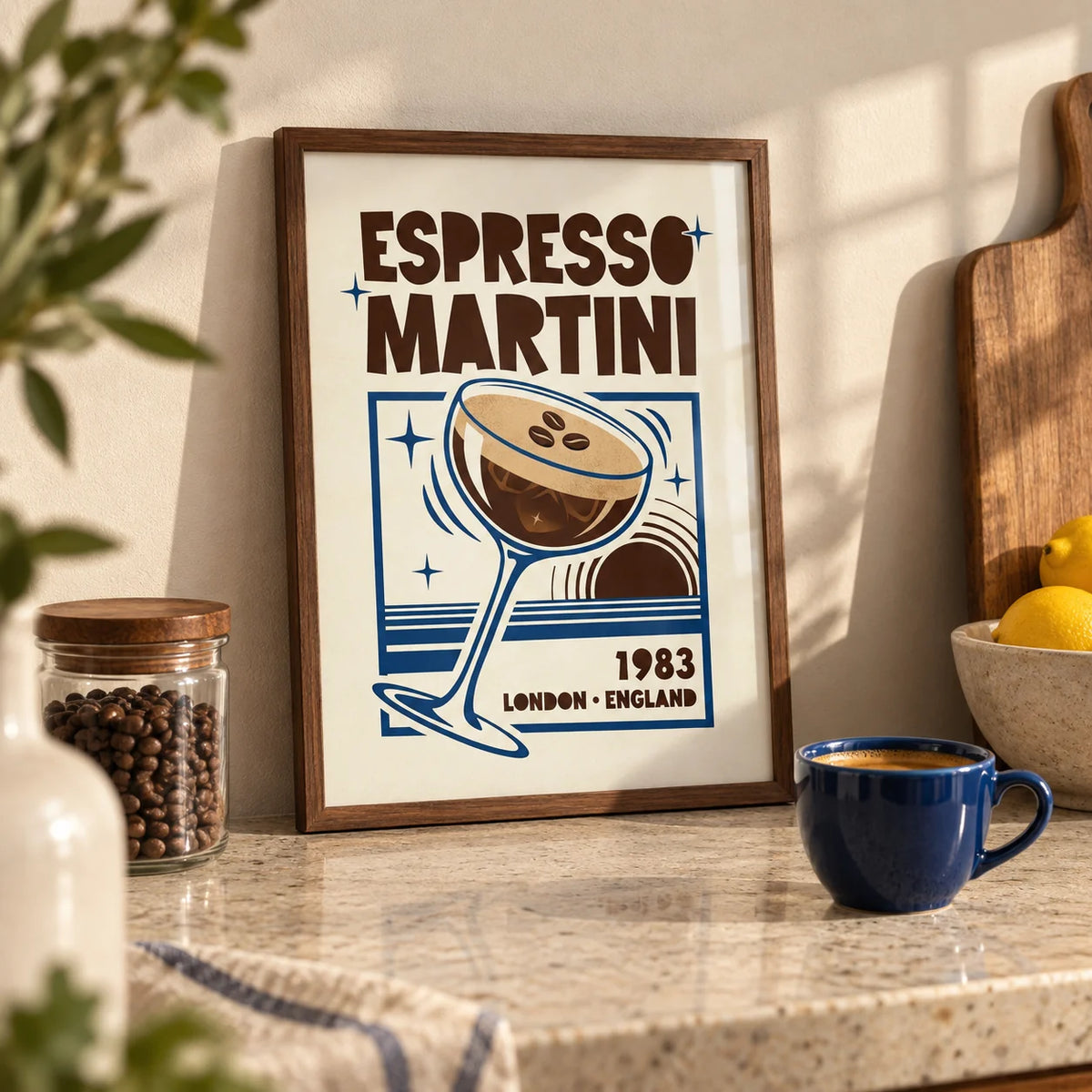Espresso Martini Print, a small A4 framed print leaning on a pale stone kitchen worktop