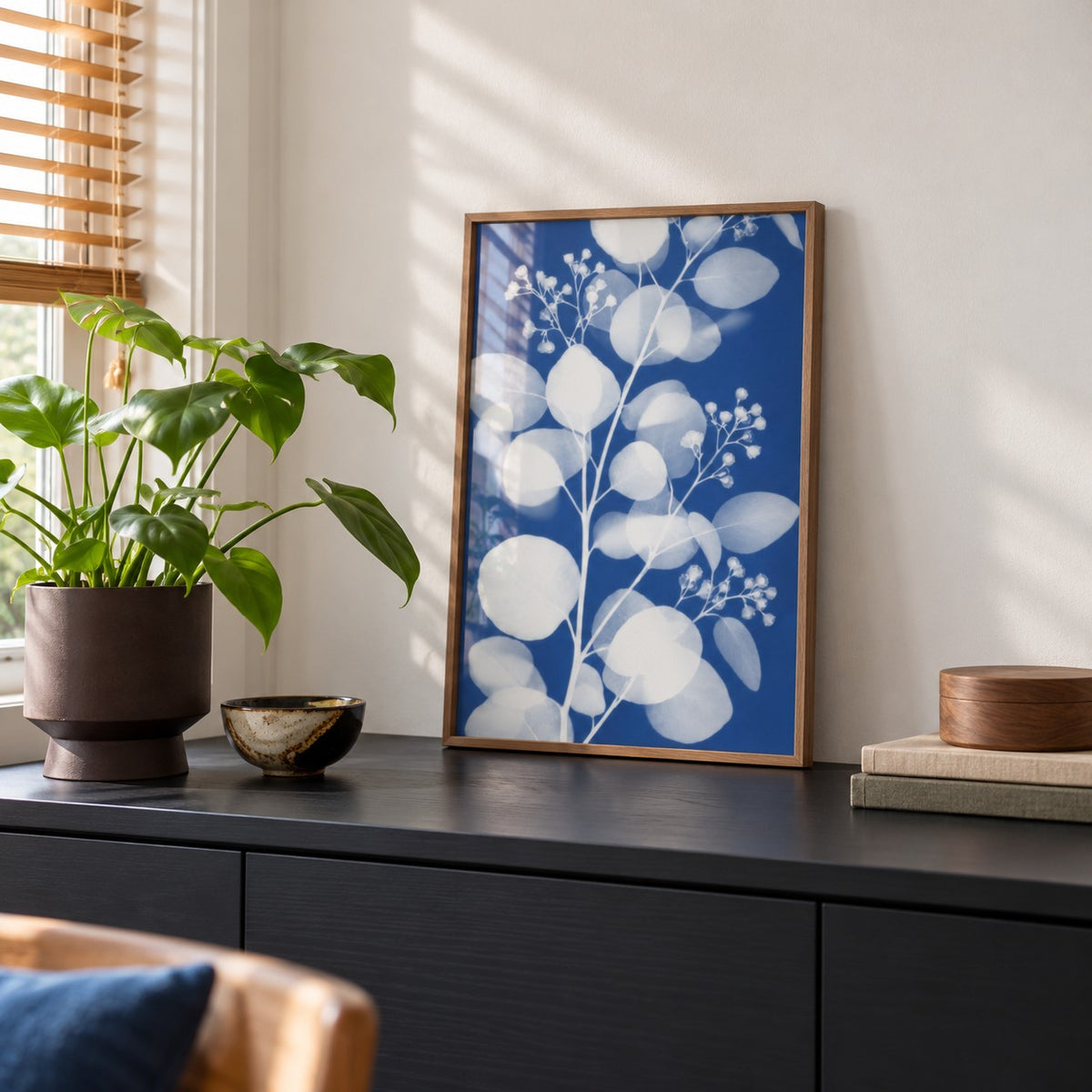 Eucalyptus Cyanotype Print styled on a black sideboard (frame not included)
