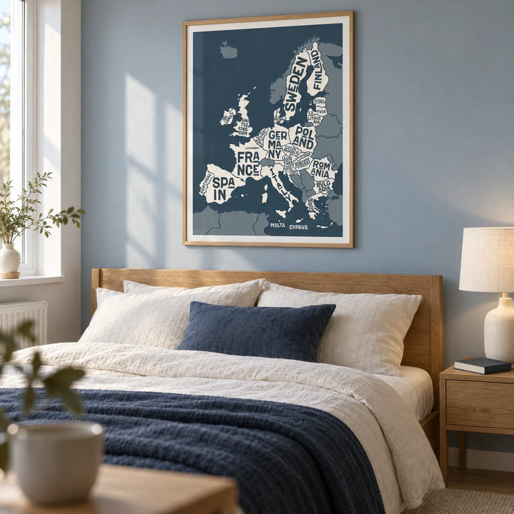 Europe Map Print, framed on the wall of a calm adult bedroom in a modern UK flat with a pale blue grey wall