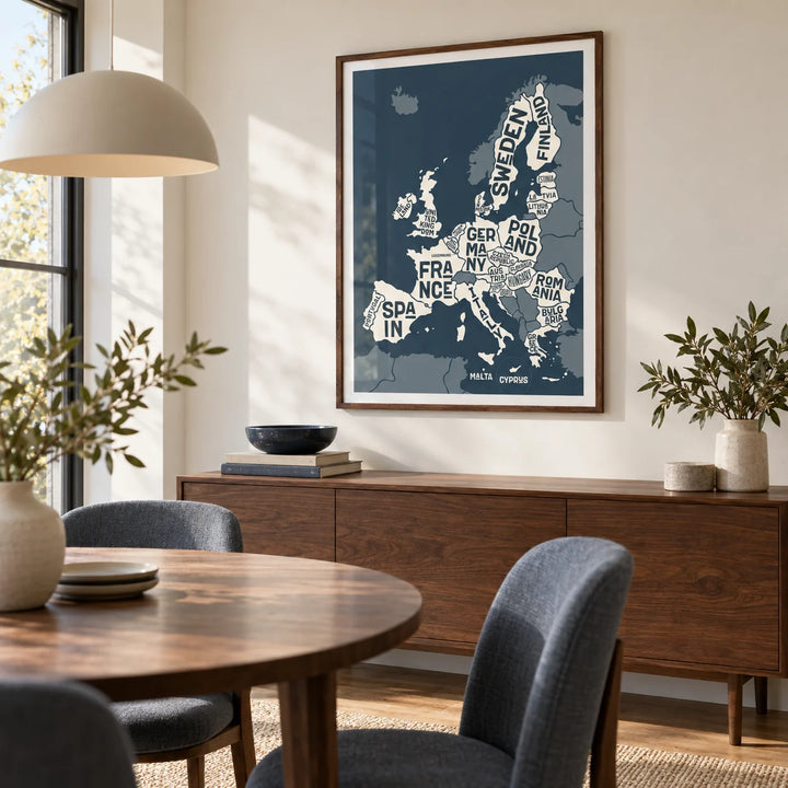 Europe Map Print, framed on the wall of a contemporary dining room with a soft ivory wall and a wide window