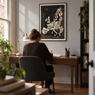 Europe Poster, framed on the wall of a compact home study in a Victorian terrace with a pale grey wall and oak floor