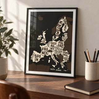 Europe Poster, a small A4 framed print leaning on a walnut desk