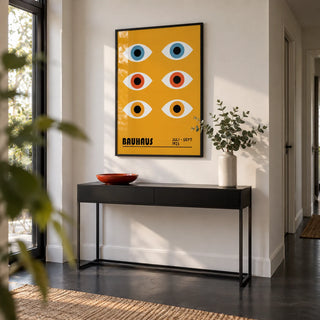Eye Poster, framed on the wall of a modern hallway with a white wall and a black floor