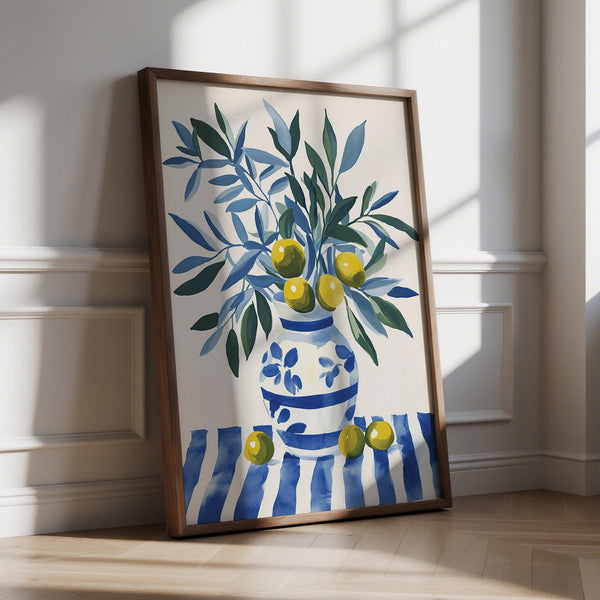 Olive tree wall art with blue and green branches in a striped ceramic vase.