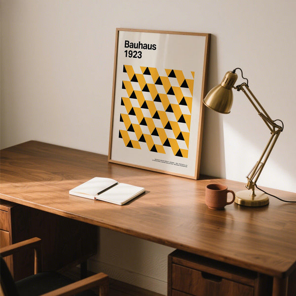 Framed Bauhaus Poster 1923 displayed in a creative studio setting.