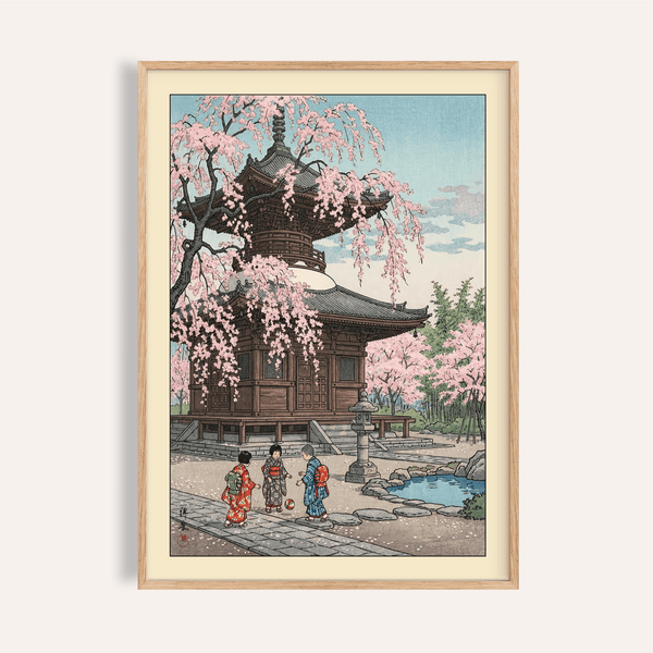 Framed view of a Japanese Cherry Blossom Art Print poster showing a wooden pagoda and cascading sakura branches