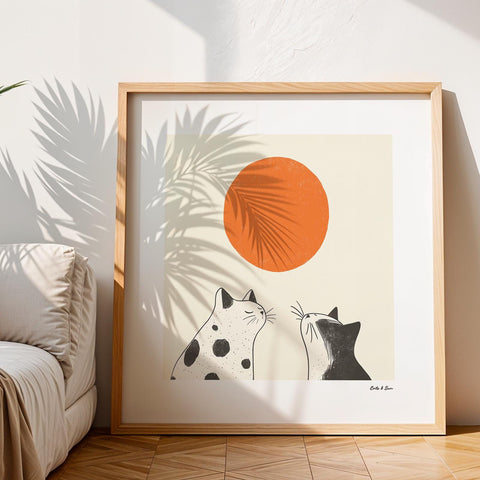 Stylish black and white cats with sun wall art.