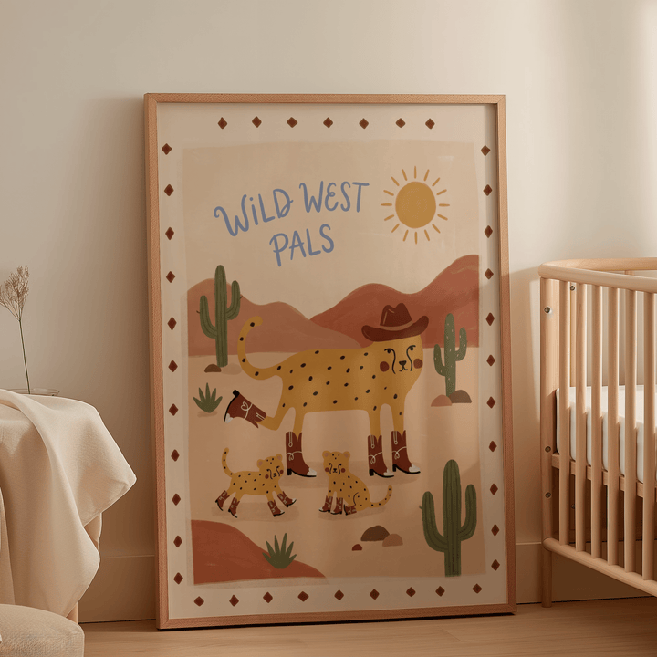 Print leaning on the floor of a nursery featuring Wild West Animal Art Print in warm brown and green tones next to a wooden crib