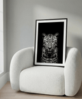 Centered leopard portrait wall art print in black and white with dark background