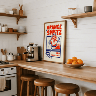 Vintage-style cocktail poster showing “ORANGE SPRITZ” text and starburst sparkles