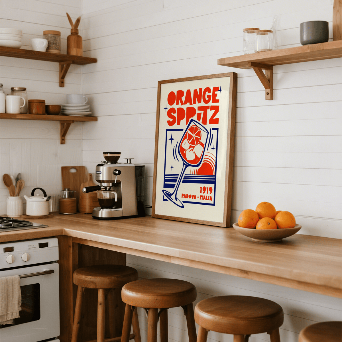 Vintage-style cocktail poster showing “ORANGE SPRITZ” text and starburst sparkles