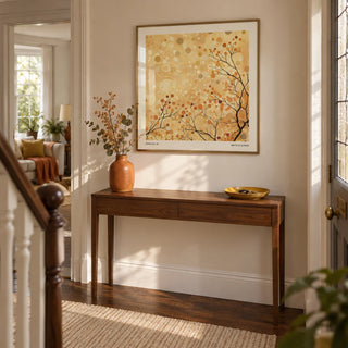 Family Room Wall Decor, framed on the wall of a welcoming hallway in a British semi-detached home with pale cream walls and dark wooden floorboards