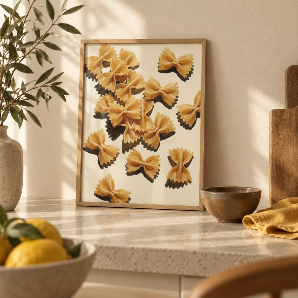 Farfalle Pasta Art, a small A4 framed print leaning on a pale stone kitchen worktop