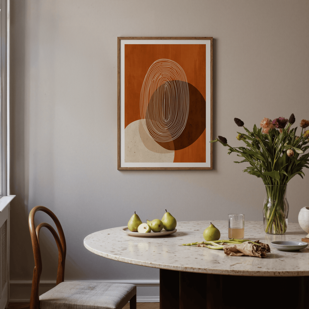 Neutral toned poster displaying concentric ovals and circular forms