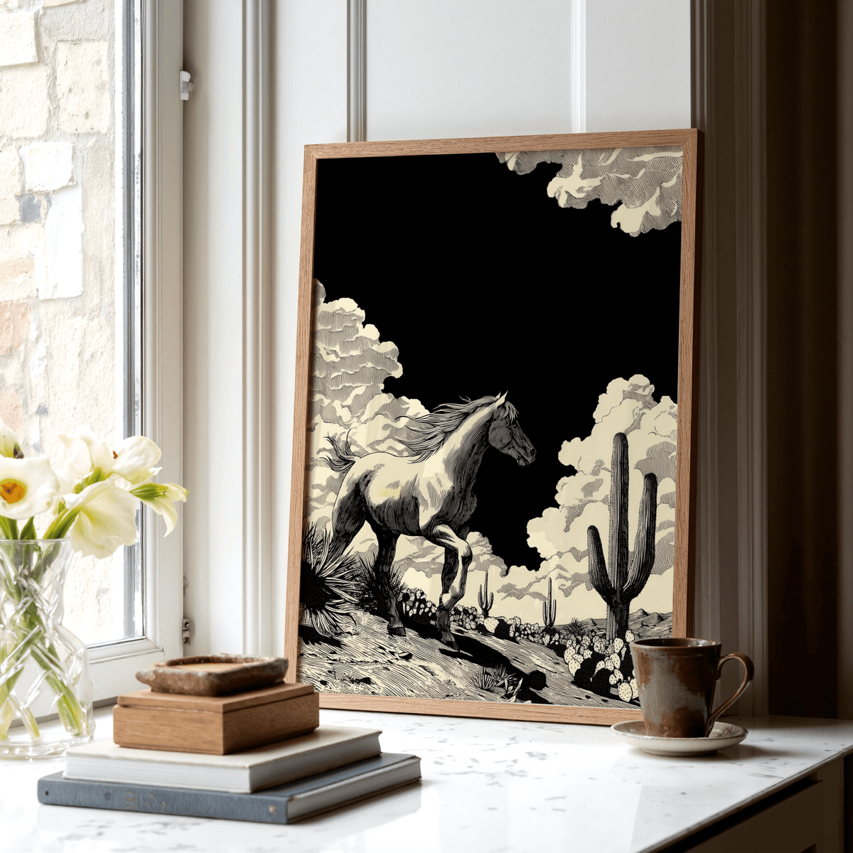 Black and white desert scene poster featuring textured ground and tall cacti