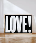 Minimalist LOVE typography poster with bold black and white design.