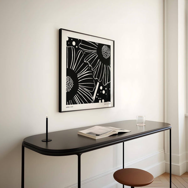 Black petals and white background featured in floral art composition