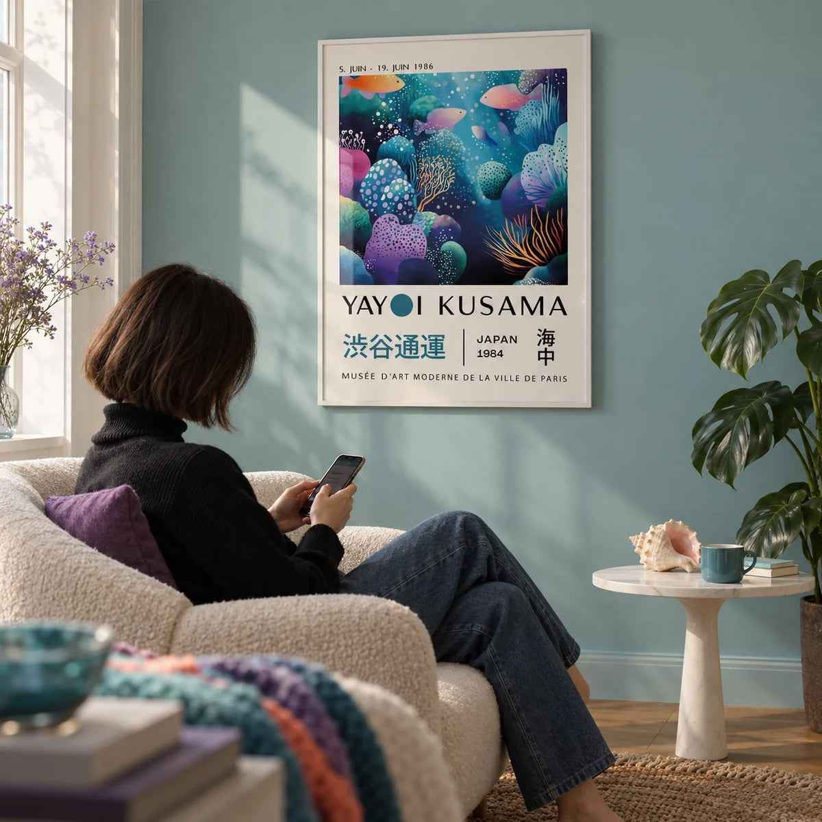 Fish Artwork Prints, framed on the wall of a reading nook with a pale teal wall in a living room