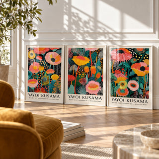 Floral Prints Set of 3 styled against a white panelled wall behind a mustard velvet armchair: Petal Paradise, Lush Tropica and Botanical Glow shown framed side by side (frames not included)