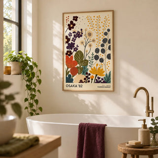 Flower Prints Art, framed on the wall of a calm bathroom with plain cream walls